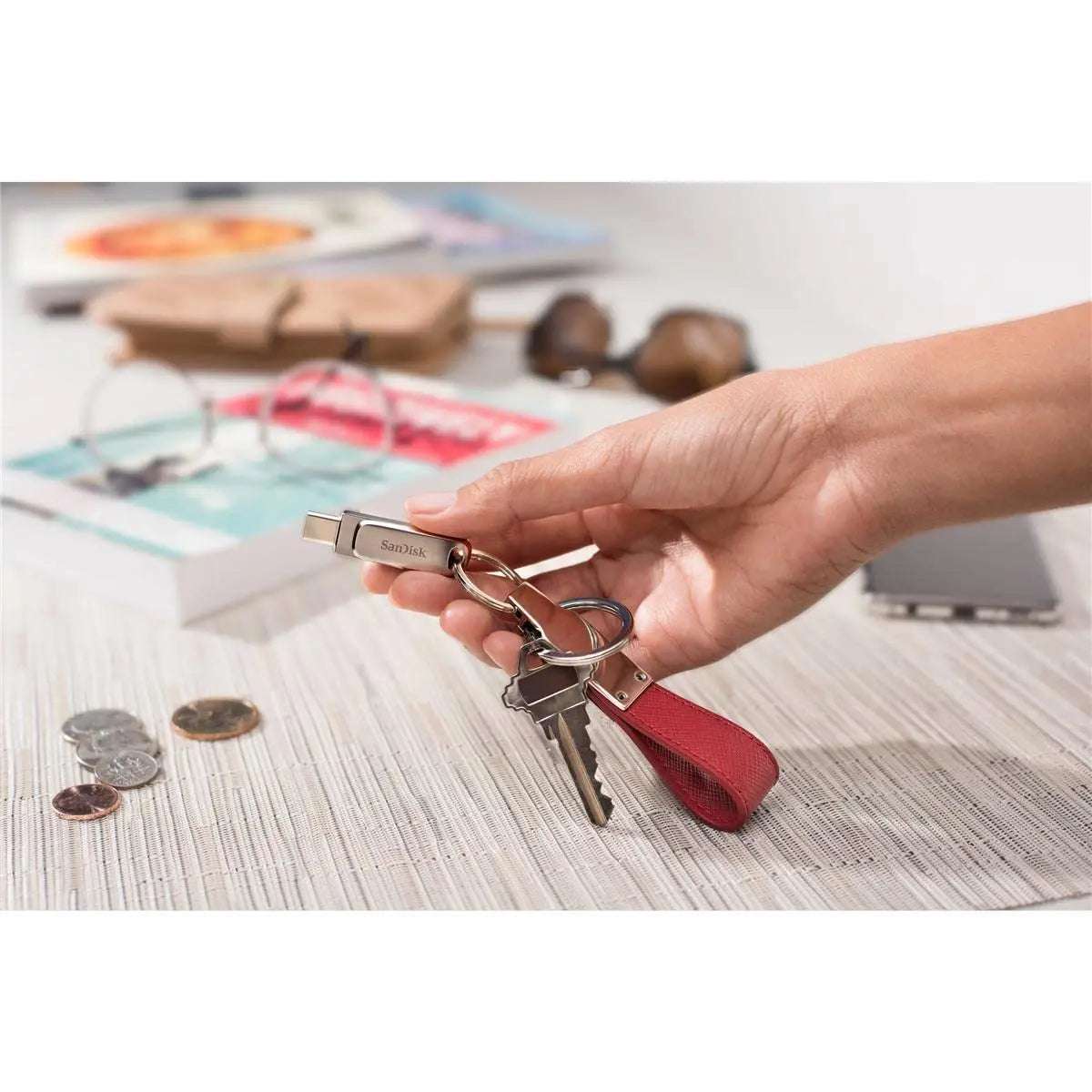 SanDisk Ultra Dual Drive Luxe USB Type-C on keychain in hand, showcasing portability.