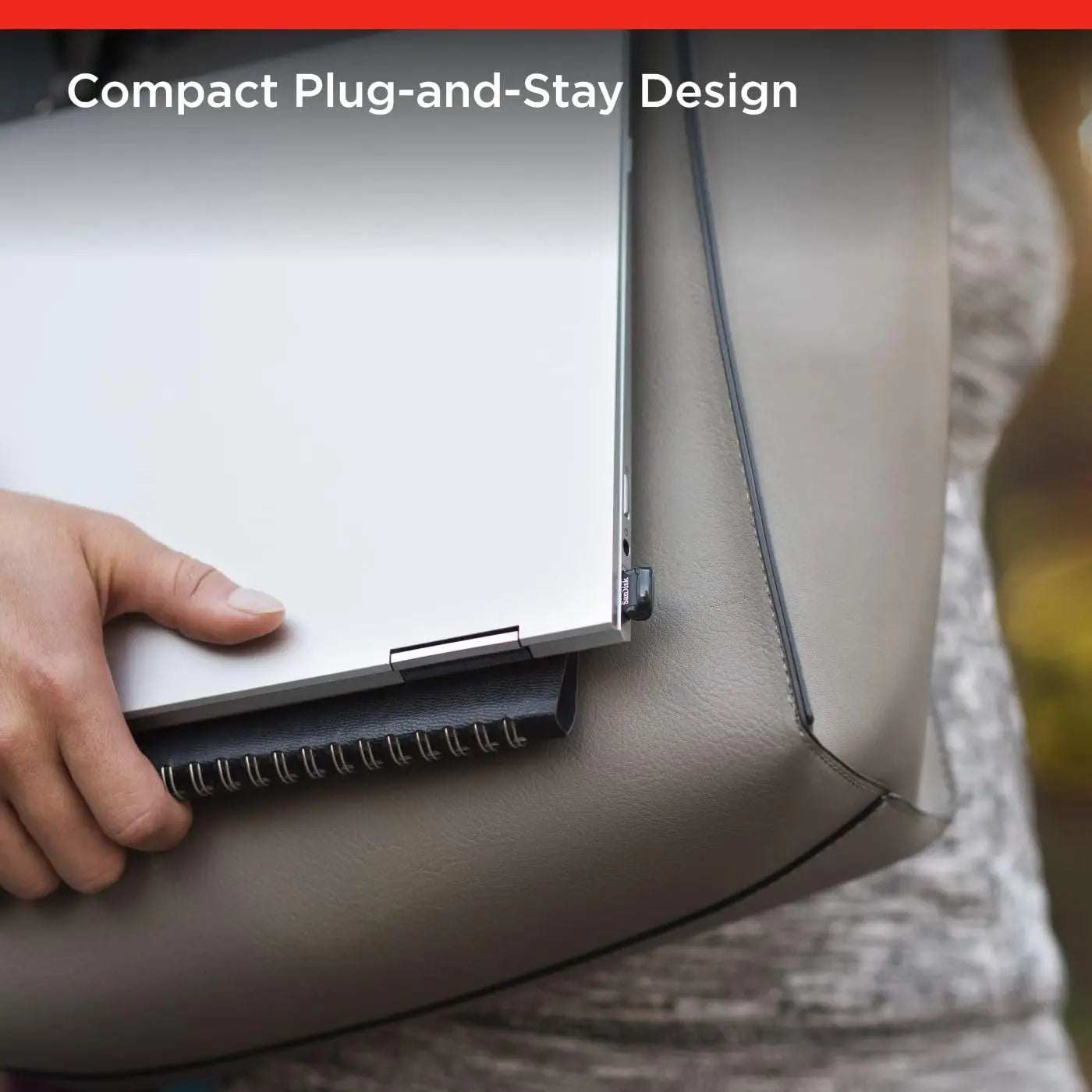 SanDisk Ultra Fit USB 3.2 Gen 1 plugged into laptop, showcasing compact plug-and-stay design.