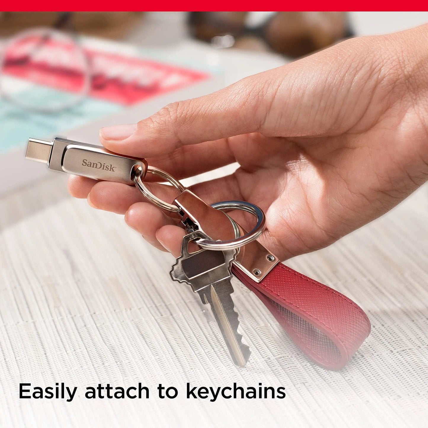 SanDisk Ultra Dual Drive Luxe USB Type-C attached to keychain for easy portability.