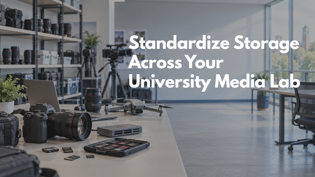 University media lab with cameras, lenses, drones, card readers, and memory cards arranged on a shared equipment table.
