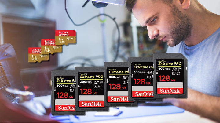 Stack of SanDisk SD and microSD cards with packaging on a desk — wholesale memory card bulk deals in Canada.