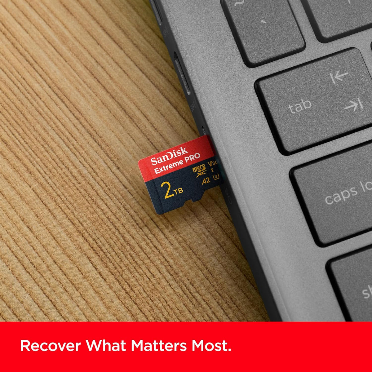 Extreme PRO 2TB microSDXC – card beside a laptop keyboard