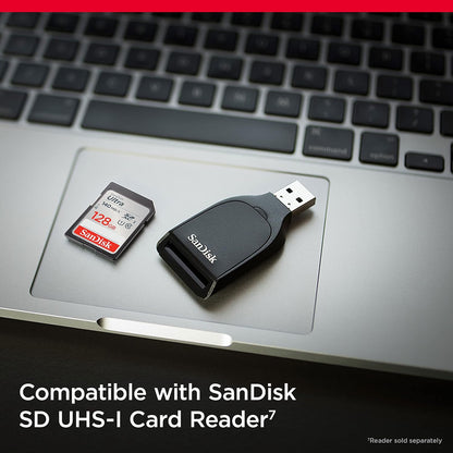 Ultra 128GB SDXC – card beside a SanDisk SD UHS-I card reader on a laptop