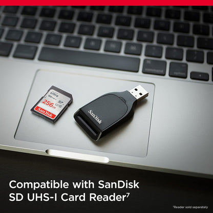 Ultra 256GB SDXC – card beside a SanDisk SD UHS-I card reader on a laptop